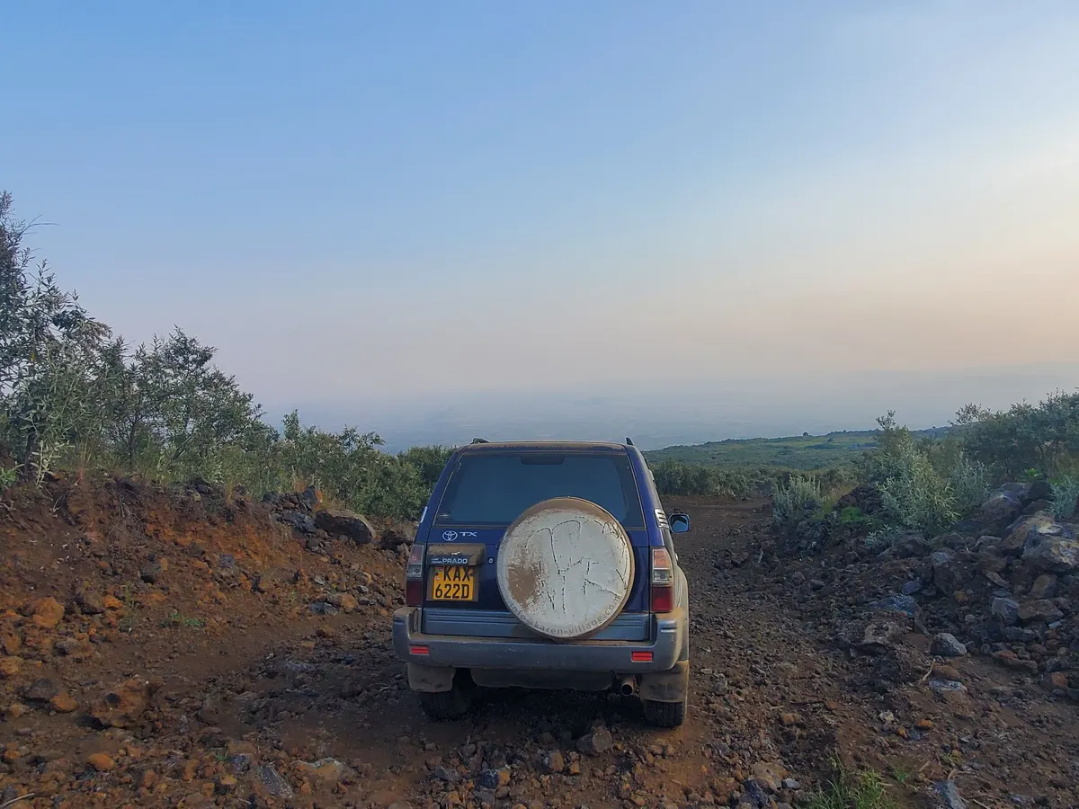 Heading down a red-earth track into the haze