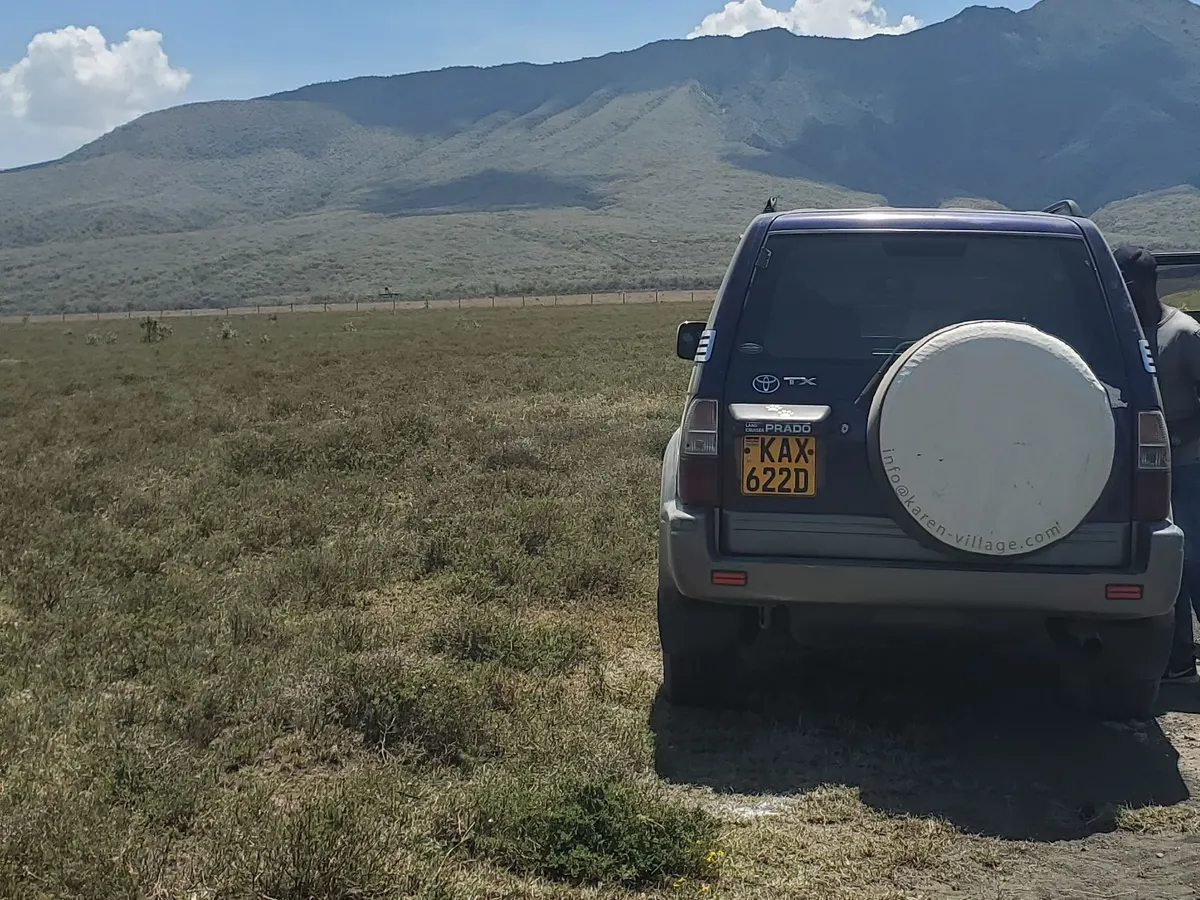 Parked on the plains below a mountain ridge